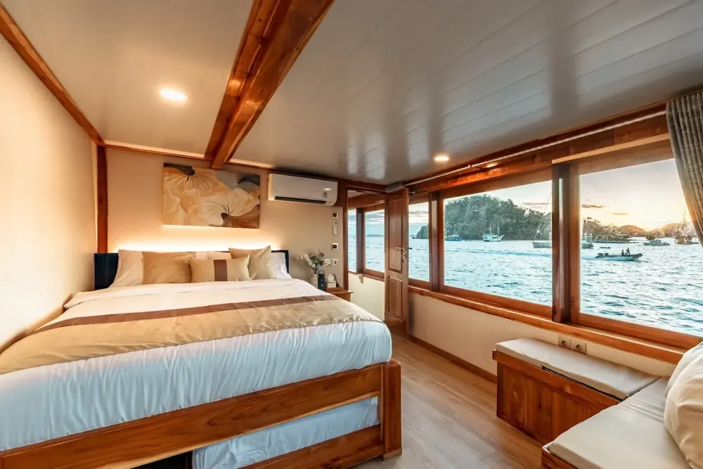 Master cabin with ocean-view windows